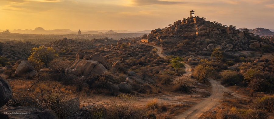 Hampi Heritage Wilderness Resort — ancient ruins and granite boulders at golden hour, Tungabhadra