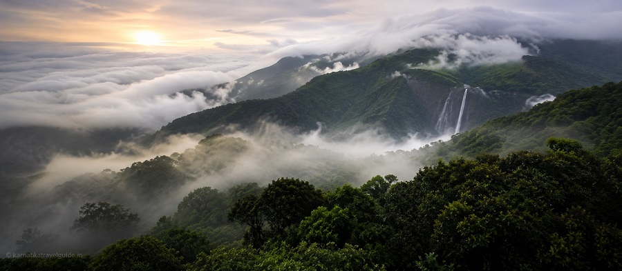 Kemmannugundi Hill Resort — misty hills at sunrise with waterfall, Western Ghats Karnataka