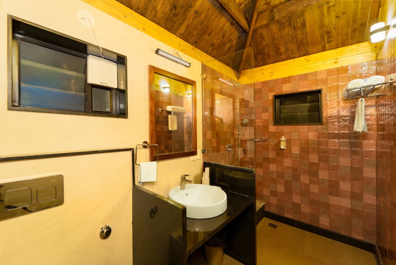 Bathroom with shower at a Miraya by the Beach cottage